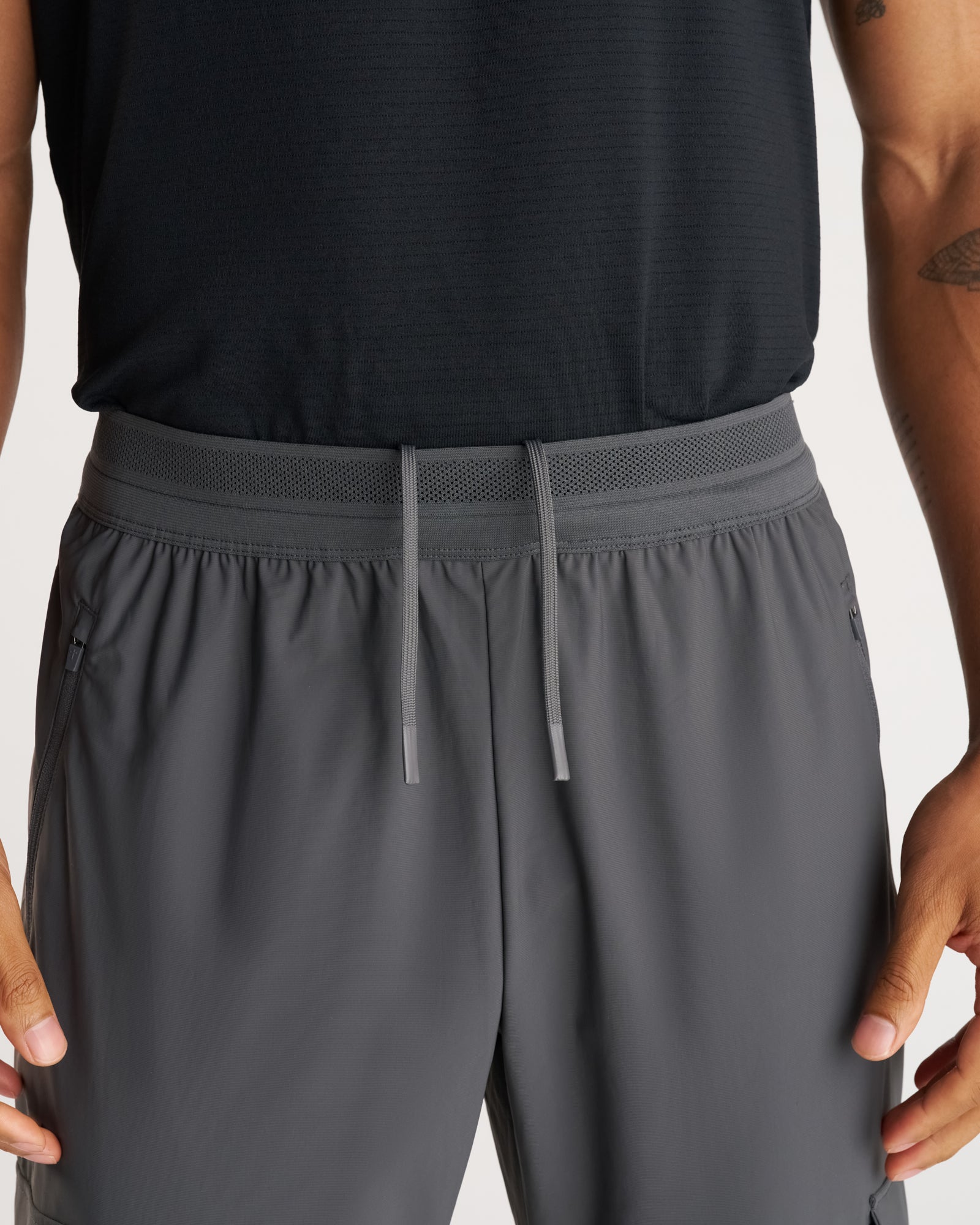 Close-up of Vapor-Lite Cargo Jogger in Space Grey showing mesh waistband and drawstring detail.