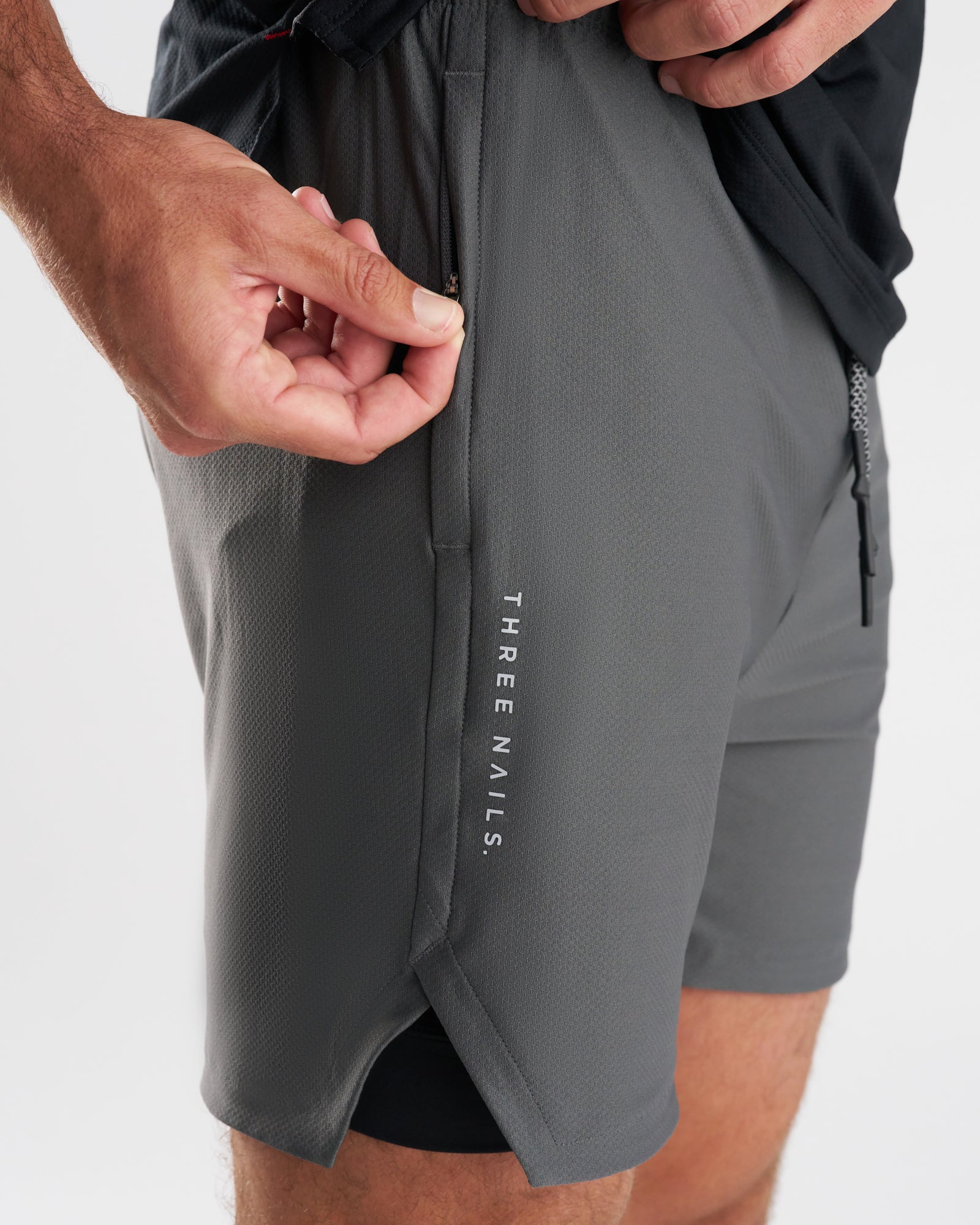 Close-up side view of Pro-Tech 2.0 Liner Short in Space Grey showing zippered pocket detail.