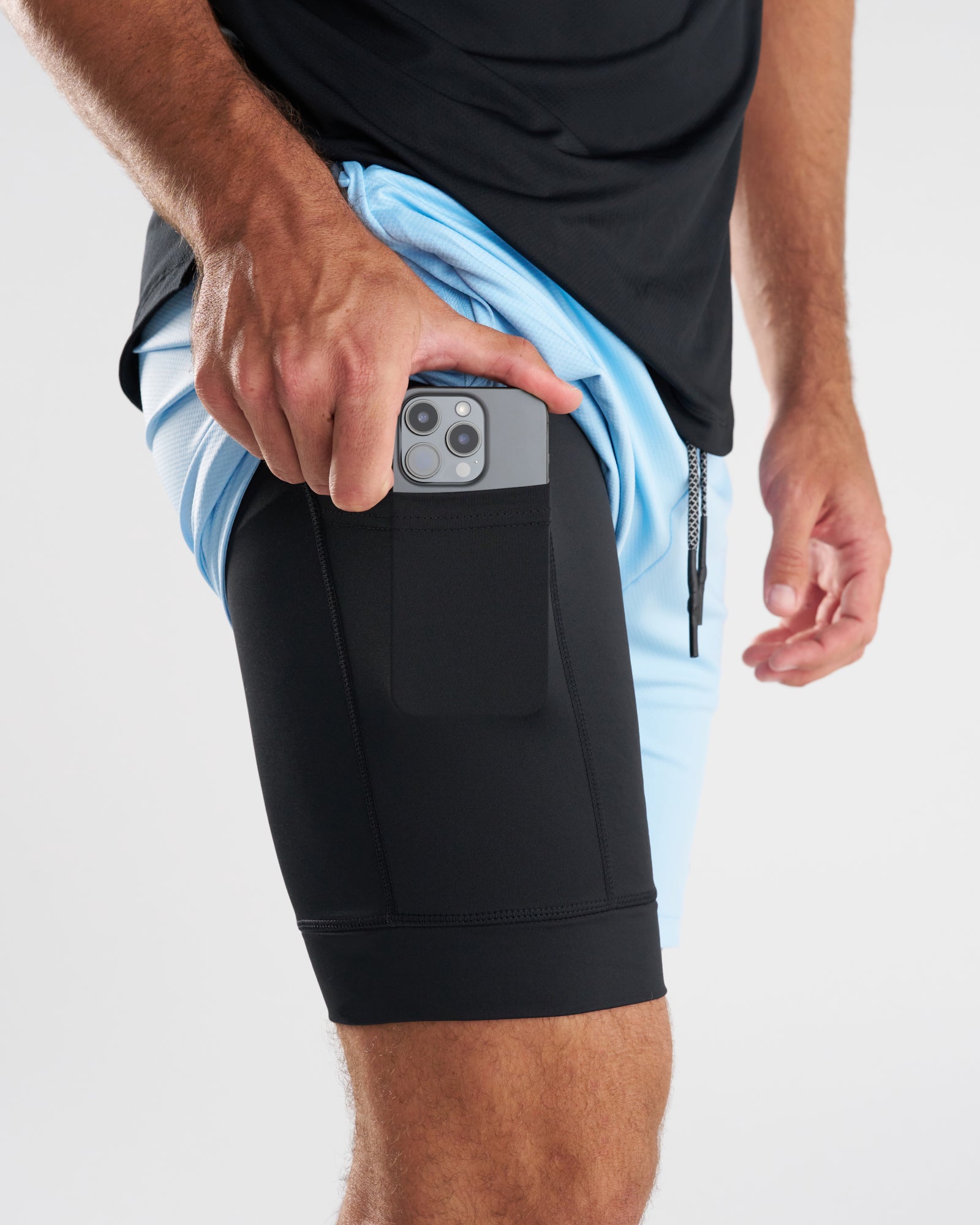 Close-up side view of Pro-Tech 2.0 Liner Short in Sky Blue showing phone pocket on black inner liner.