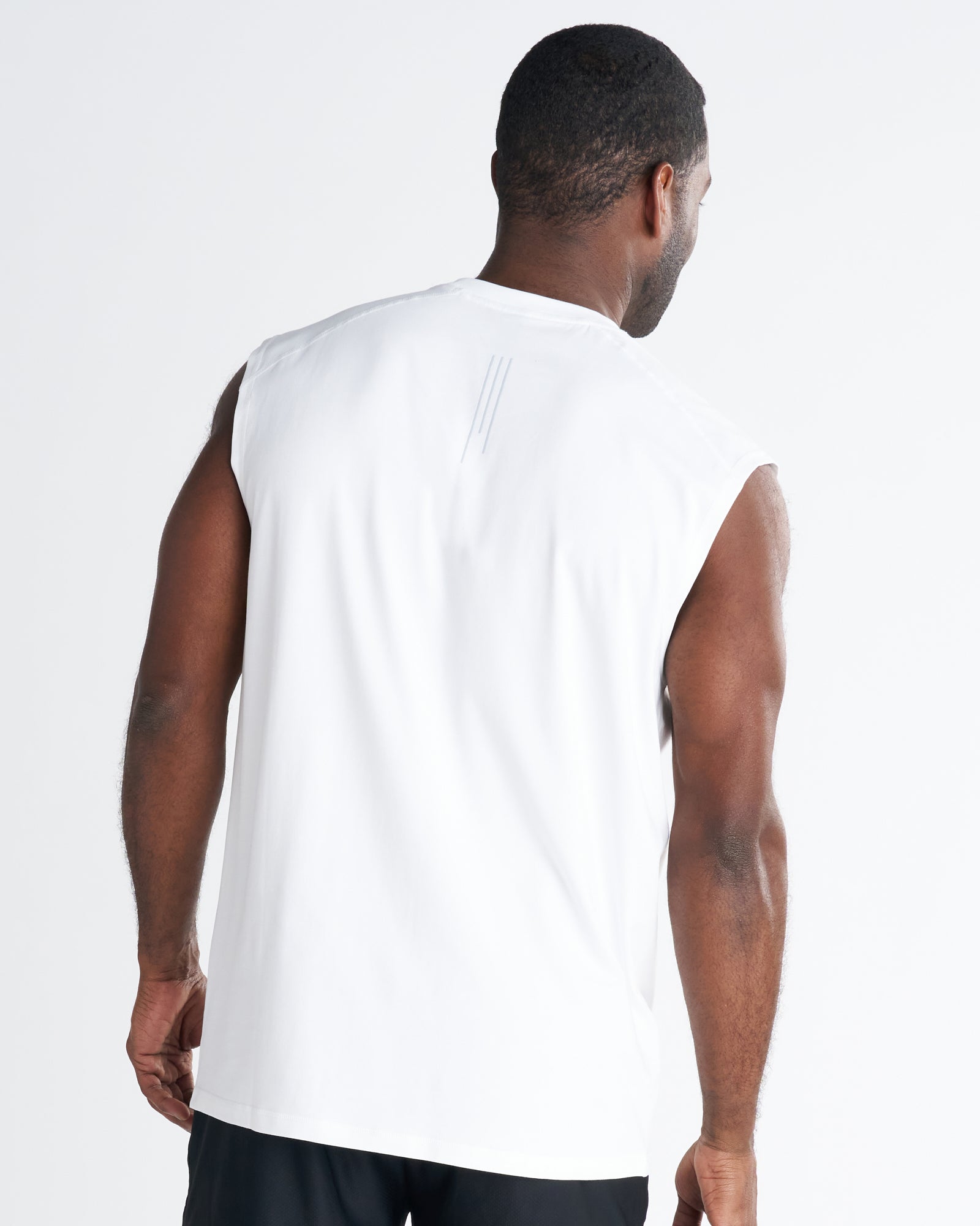 Back view of the Core Raglan Cutoff in white, showing relaxed fit and subtle logo detail at upper back.