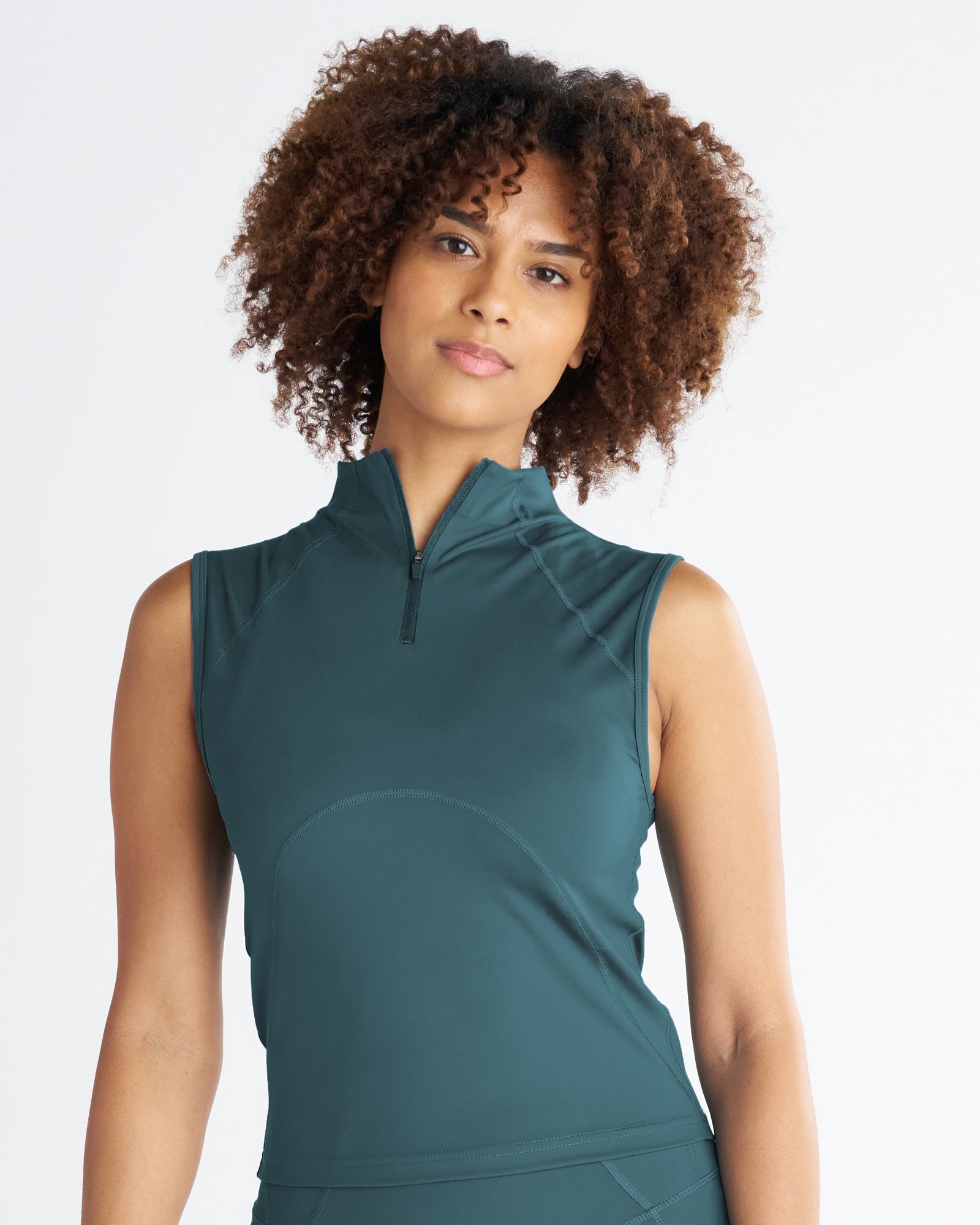 Front view of the Endura-Train Quarter Zip Tank in Teal on a model, showing the mock neck zip collar and sleeveless fit.