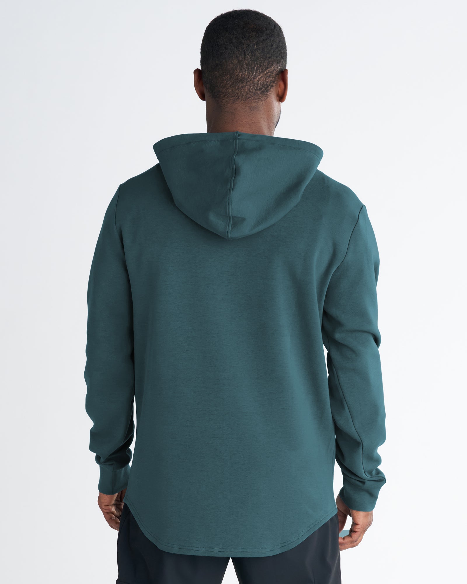 Back view of the Pro-Tech Hoodie in Teal, showing curved hem, hood construction, and clean seam details.
