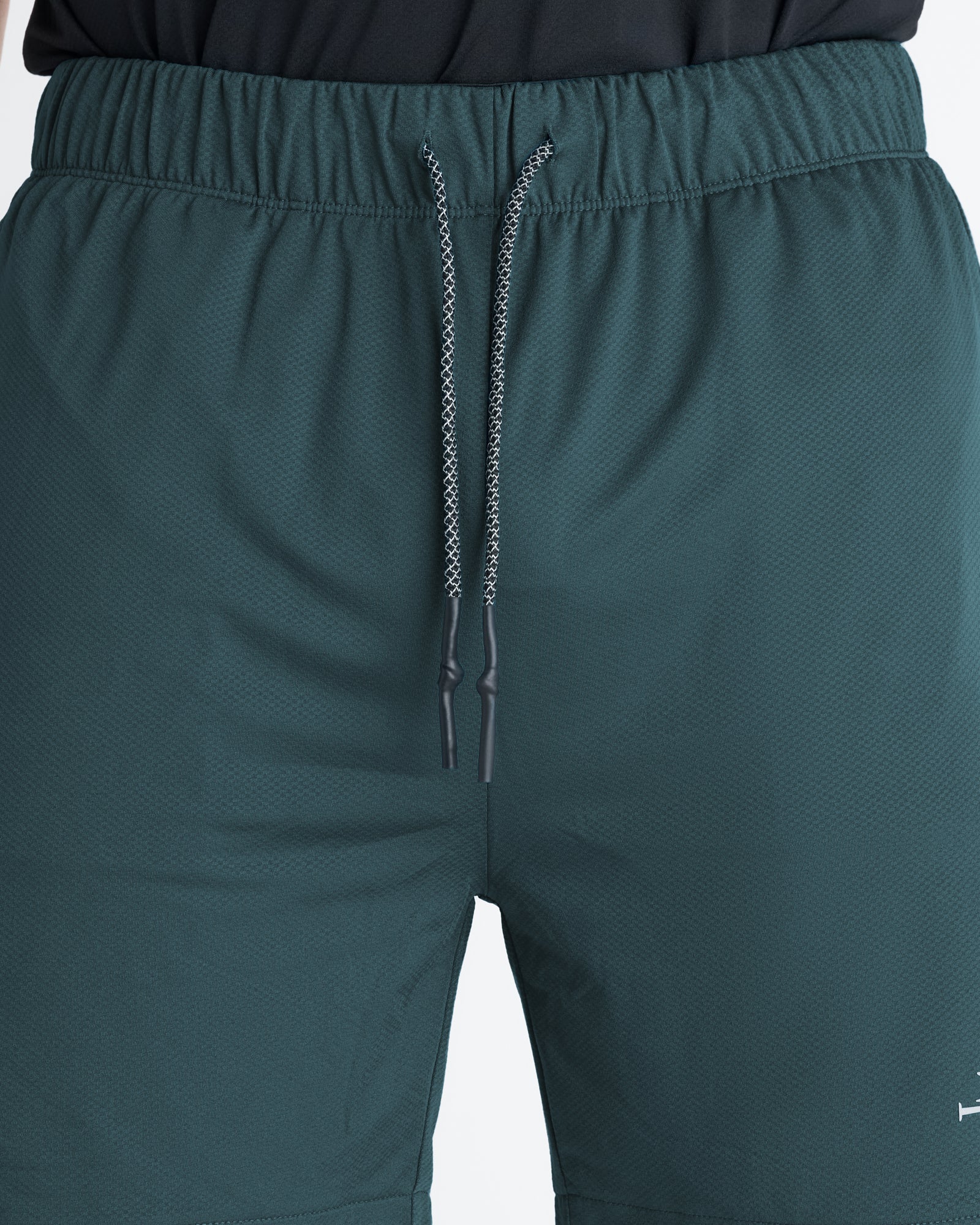 Close-up of the Pro-Tech 2.0 Liner Short in Teal showing the elastic waistband and drawstring detail.