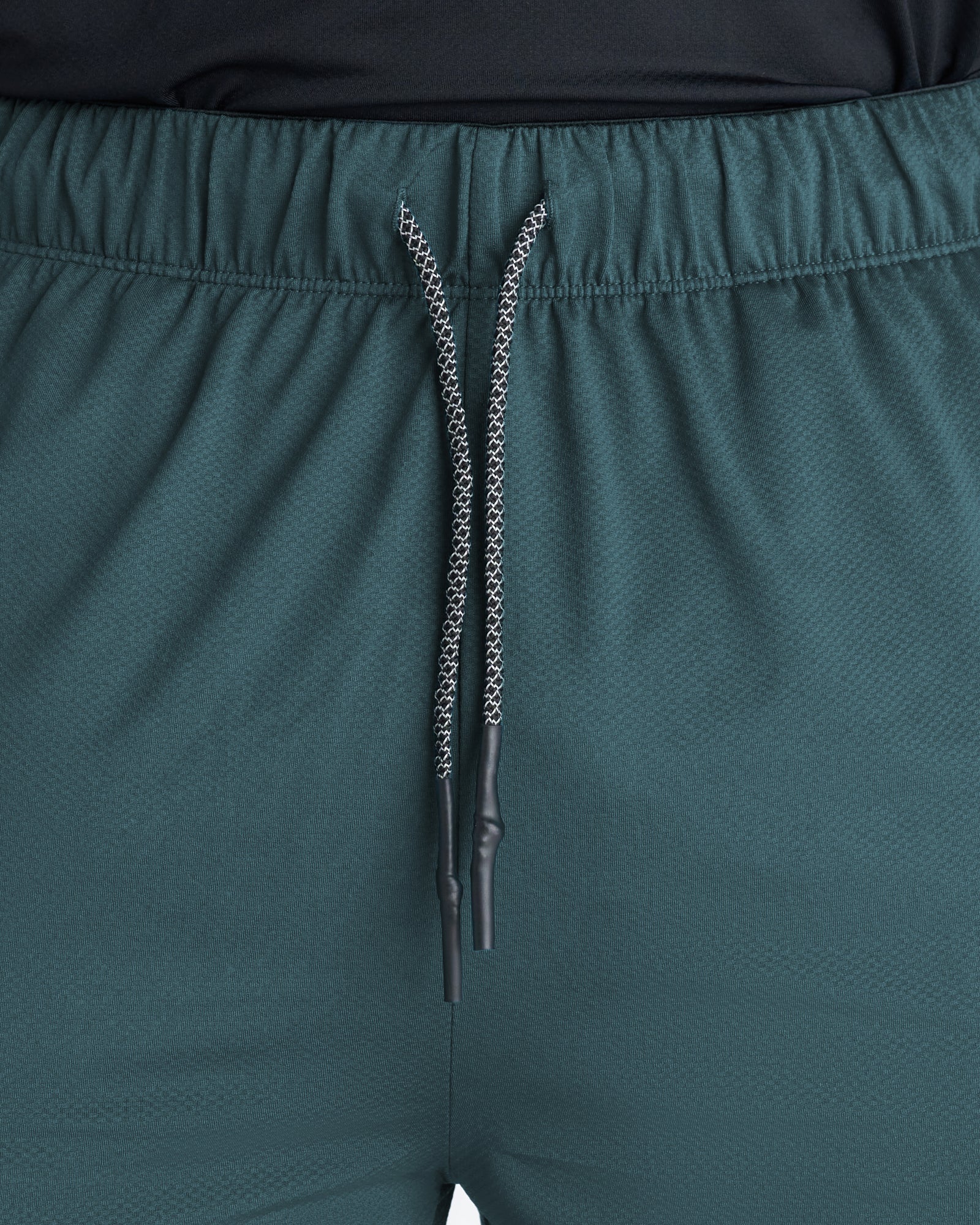 Close-up of the Pro-Tech 2.0 Linerless Short in Teal showing the elastic waistband and black-tipped drawcord detail.