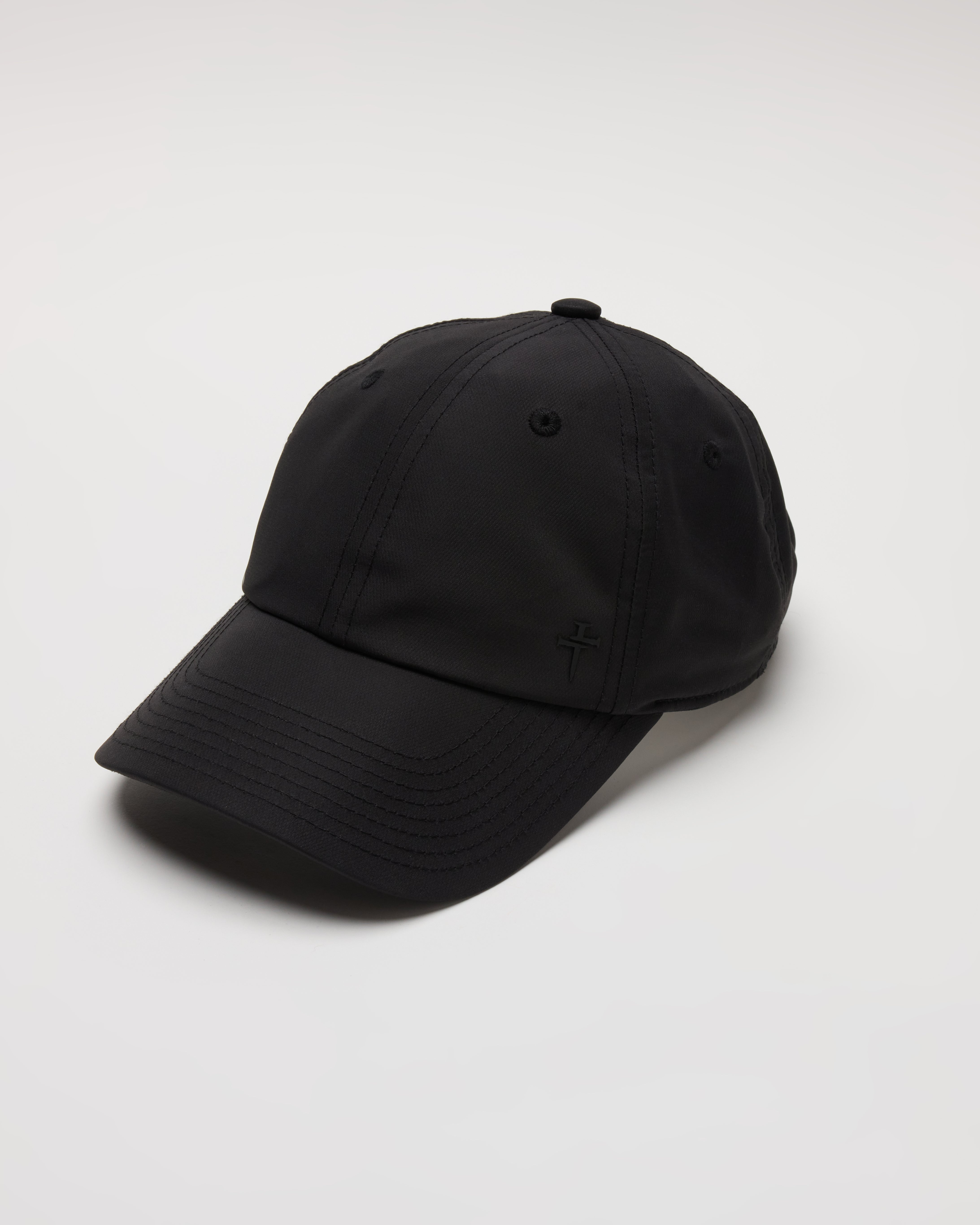 Women's Sport Cap in black, flatlay angled view showing structured crown, curved brim, and tonal cross embroidery.