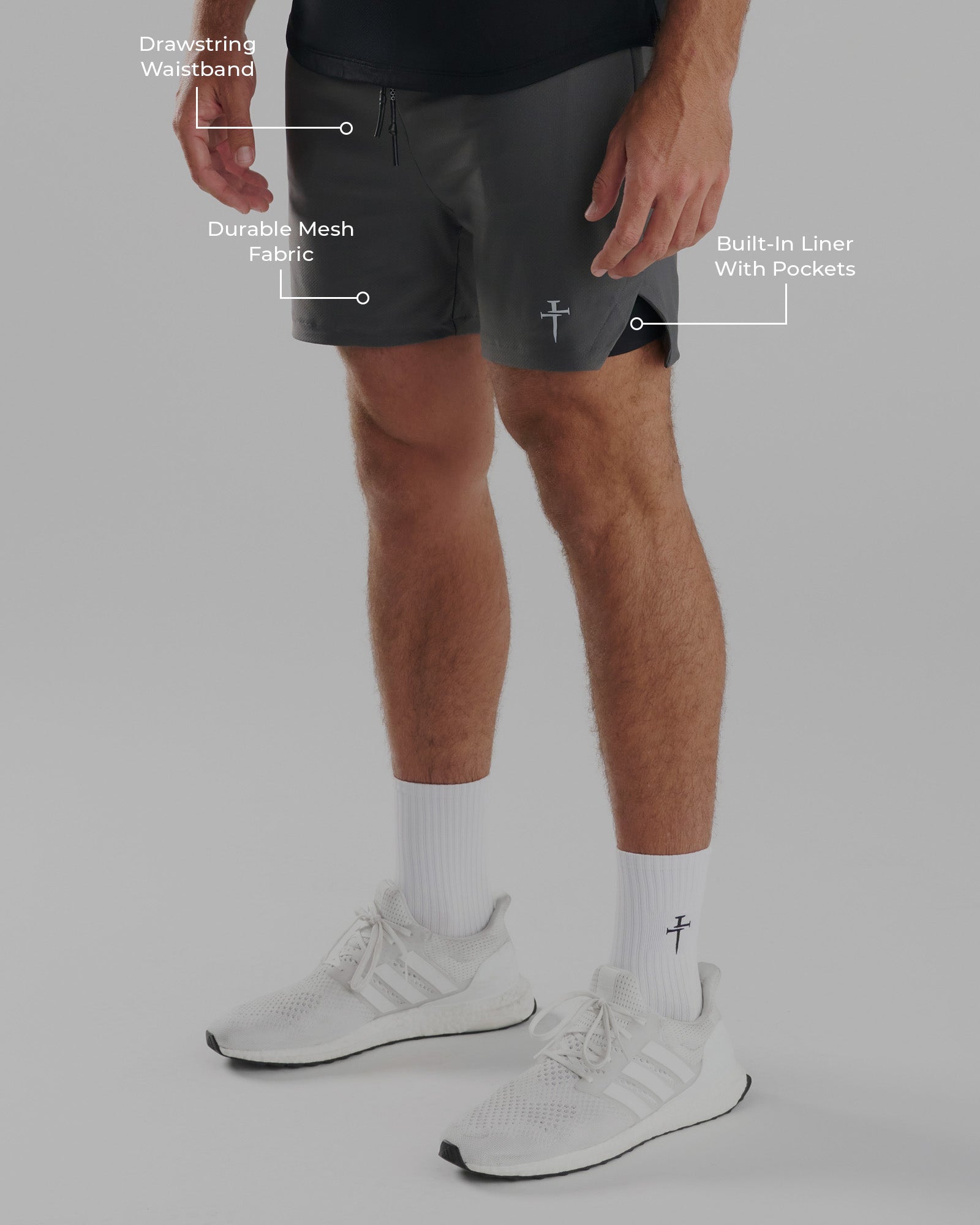 Pro-Tech 2.0 Liner Short in Space Grey on a male model, side angle, with labeled features including drawstring waistband, mesh fabric, and built-in liner.