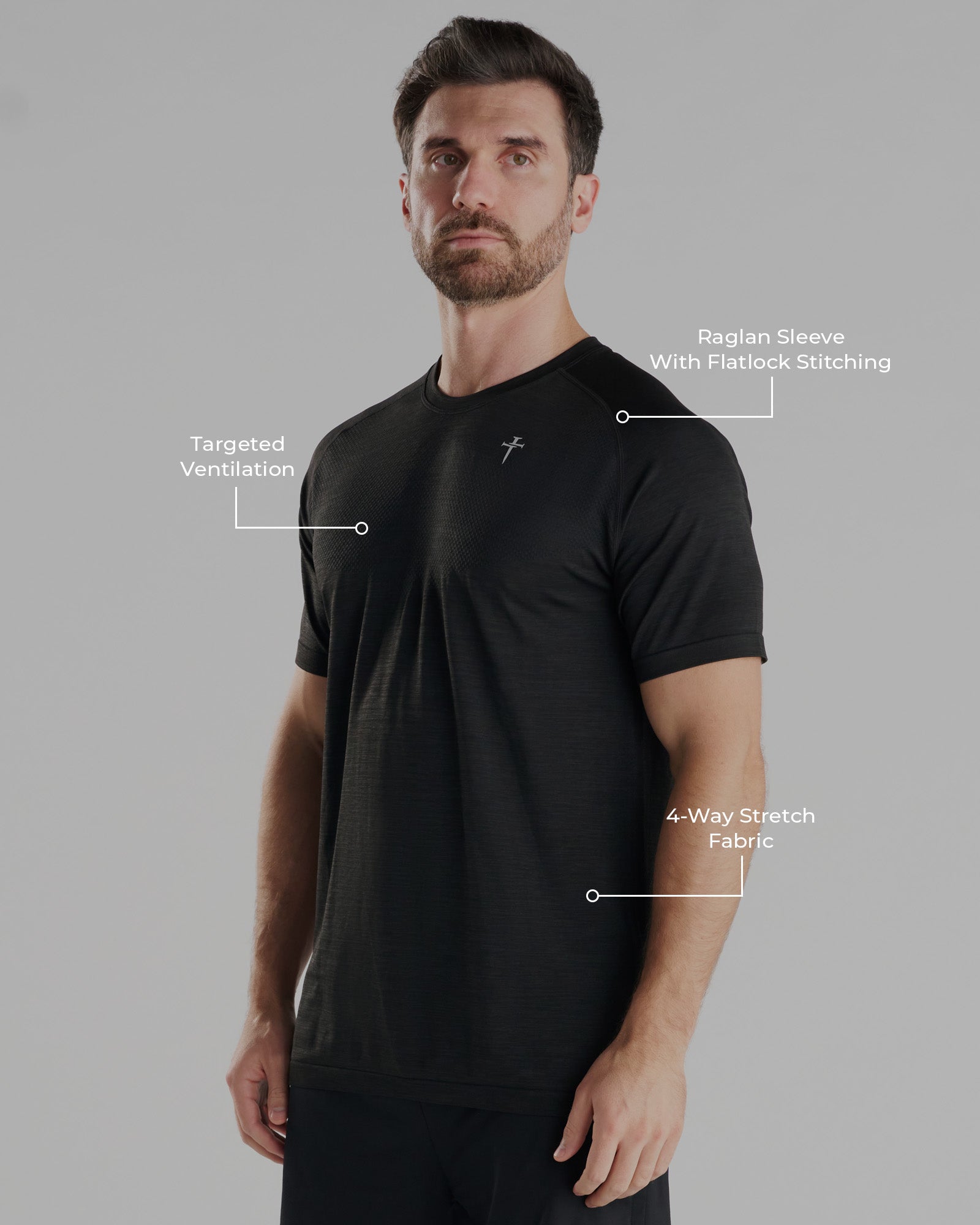 Black Marl Seamless Tee on model, side angle showing raglan sleeve, targeted ventilation, and 4-way stretch fabric callouts