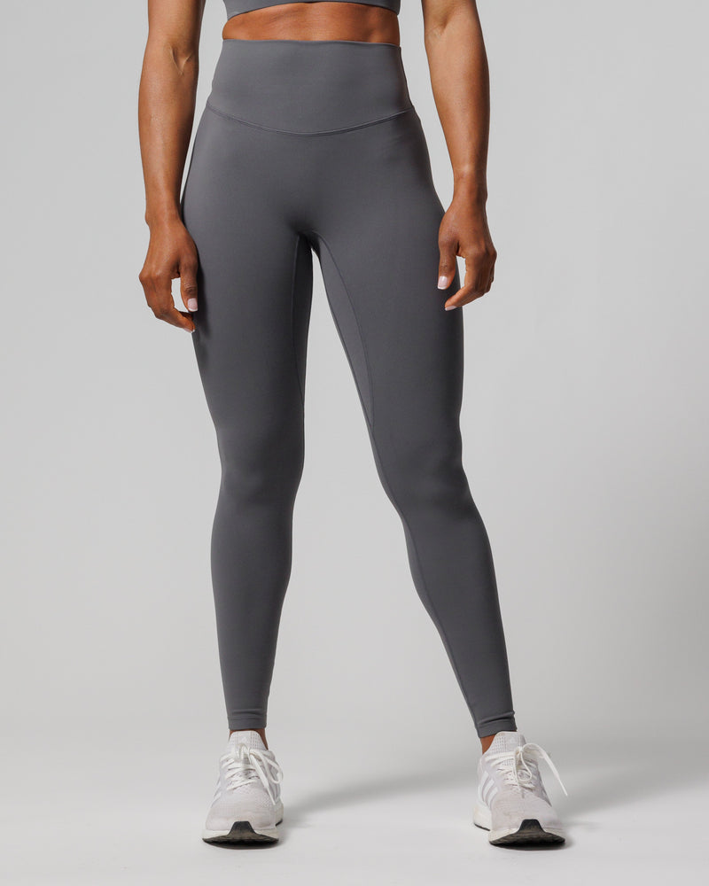 Front view of the Nova Legging 27" in charcoal gray on a model, showing high waistband and full-length fit.