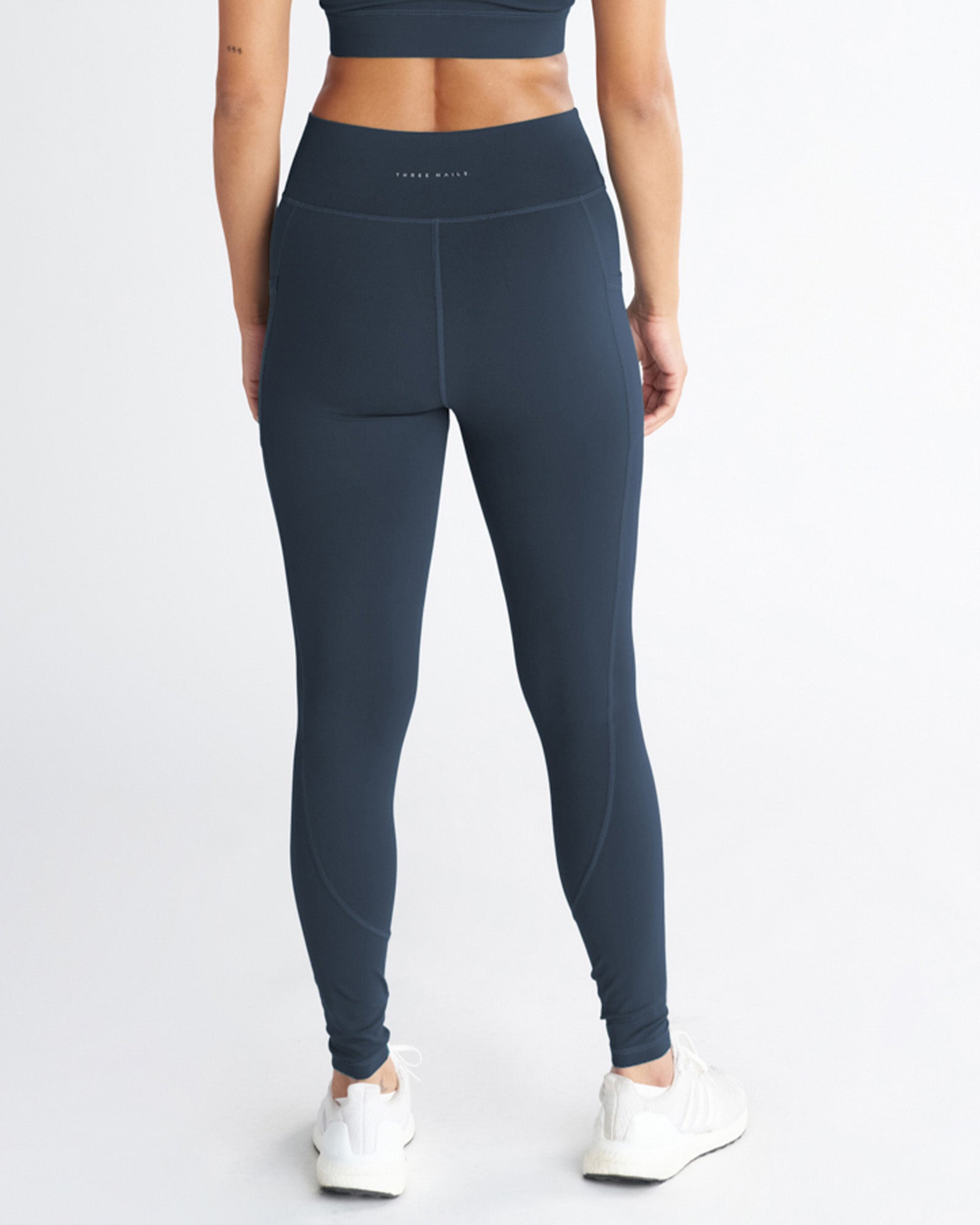 Back view of Nova Pocket Legging 27" in Midnight Navy, showing high waistband and side pockets.