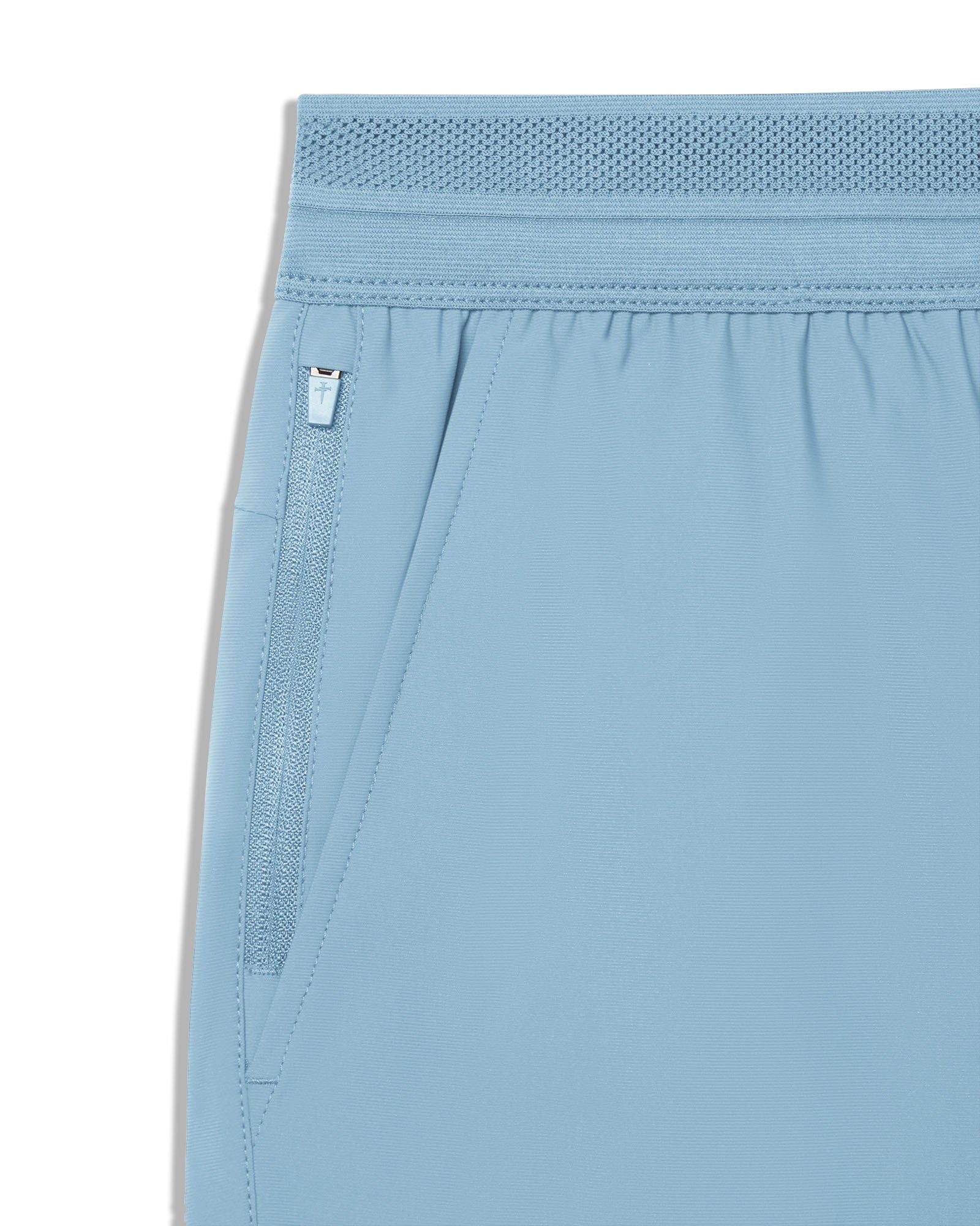 Close-up of the Sky Blue Vapor-Lite Hybrid Short waistband and zippered side pocket detail.