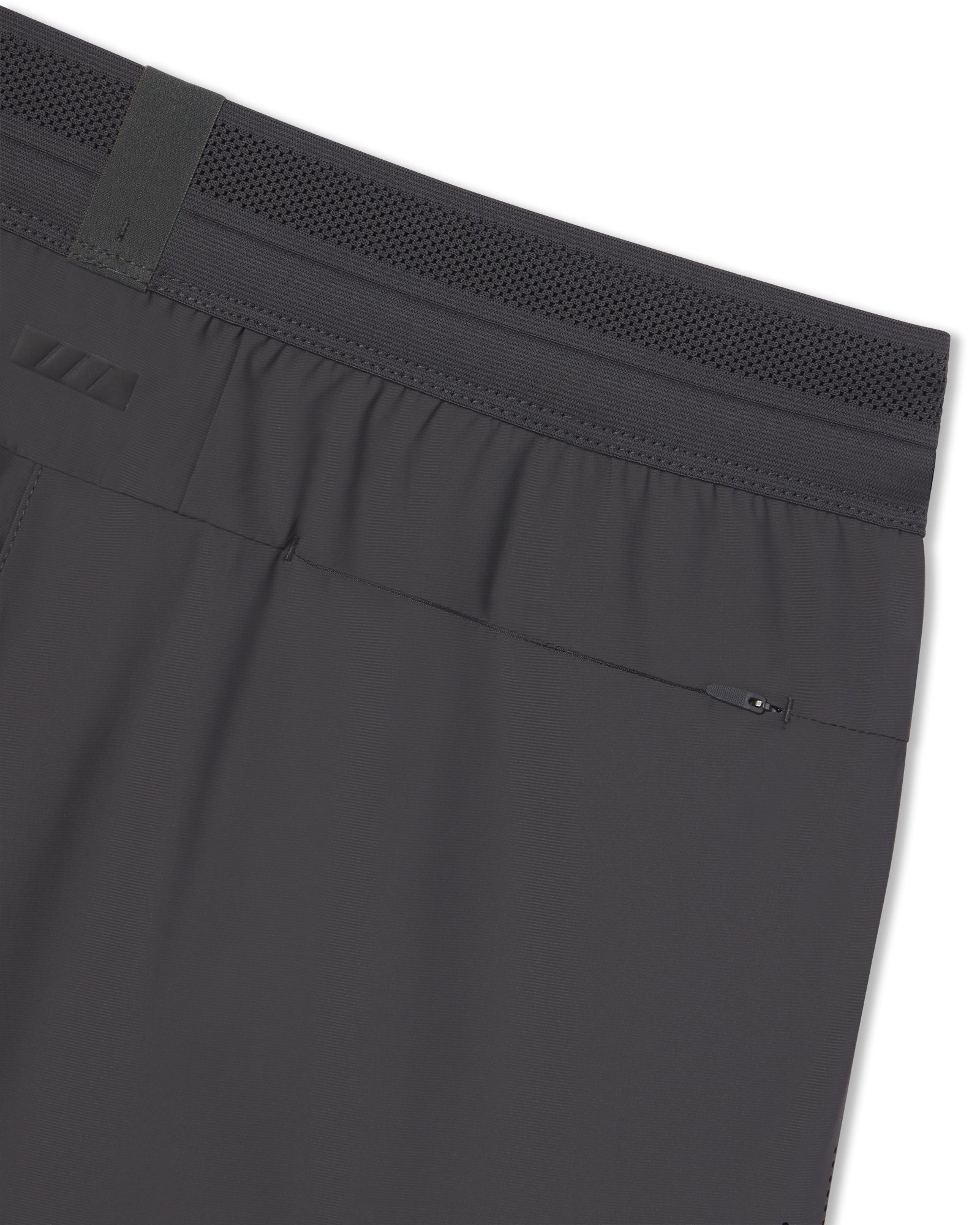 Close-up of the Vapor-Lite Hybrid Short in Space Grey showing mesh waistband and rear zip pocket detail.