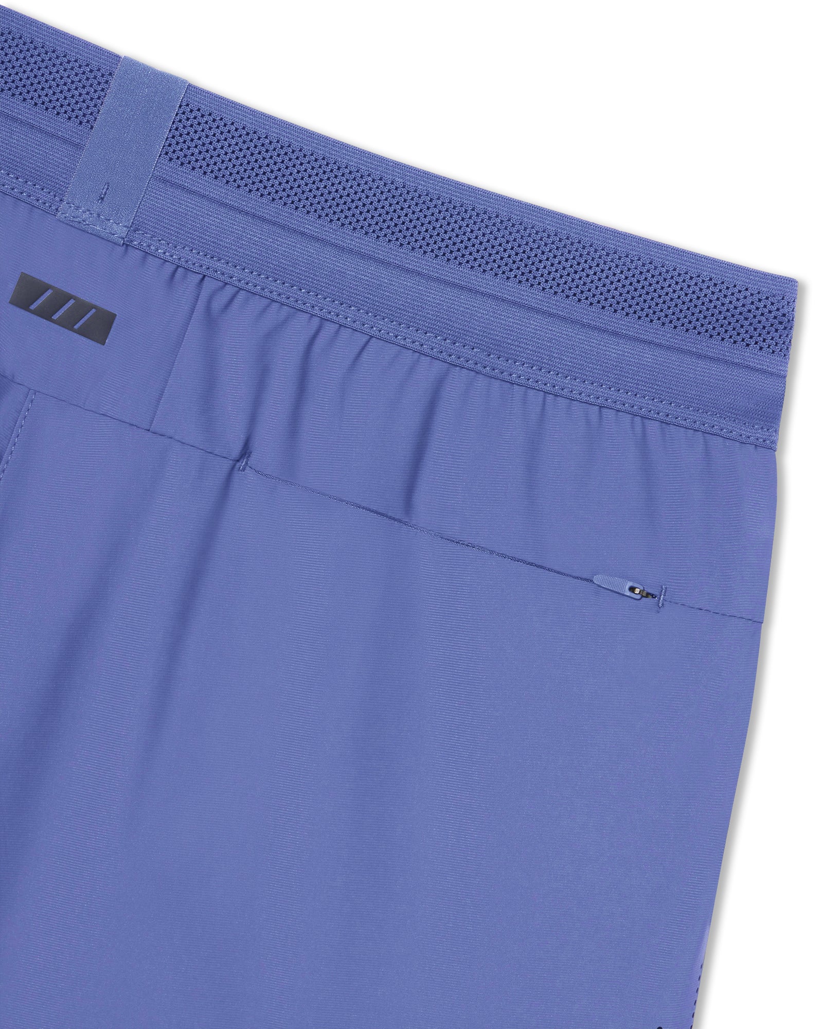 Close-up of Vapor-Lite Liner Short Cross in Serene Blue showing mesh waistband, elastic back, and zippered rear pocket.