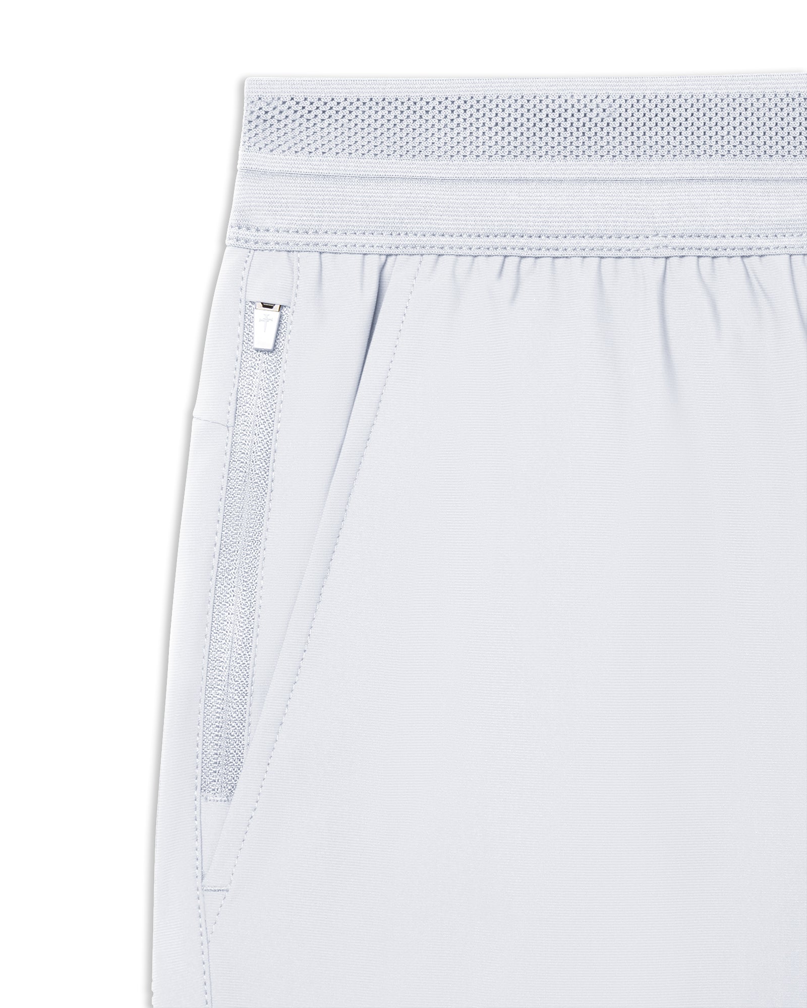 Close-up of Vapor-Lite Hybrid Short in Stone showing zippered side pocket and elastic mesh waistband detail.