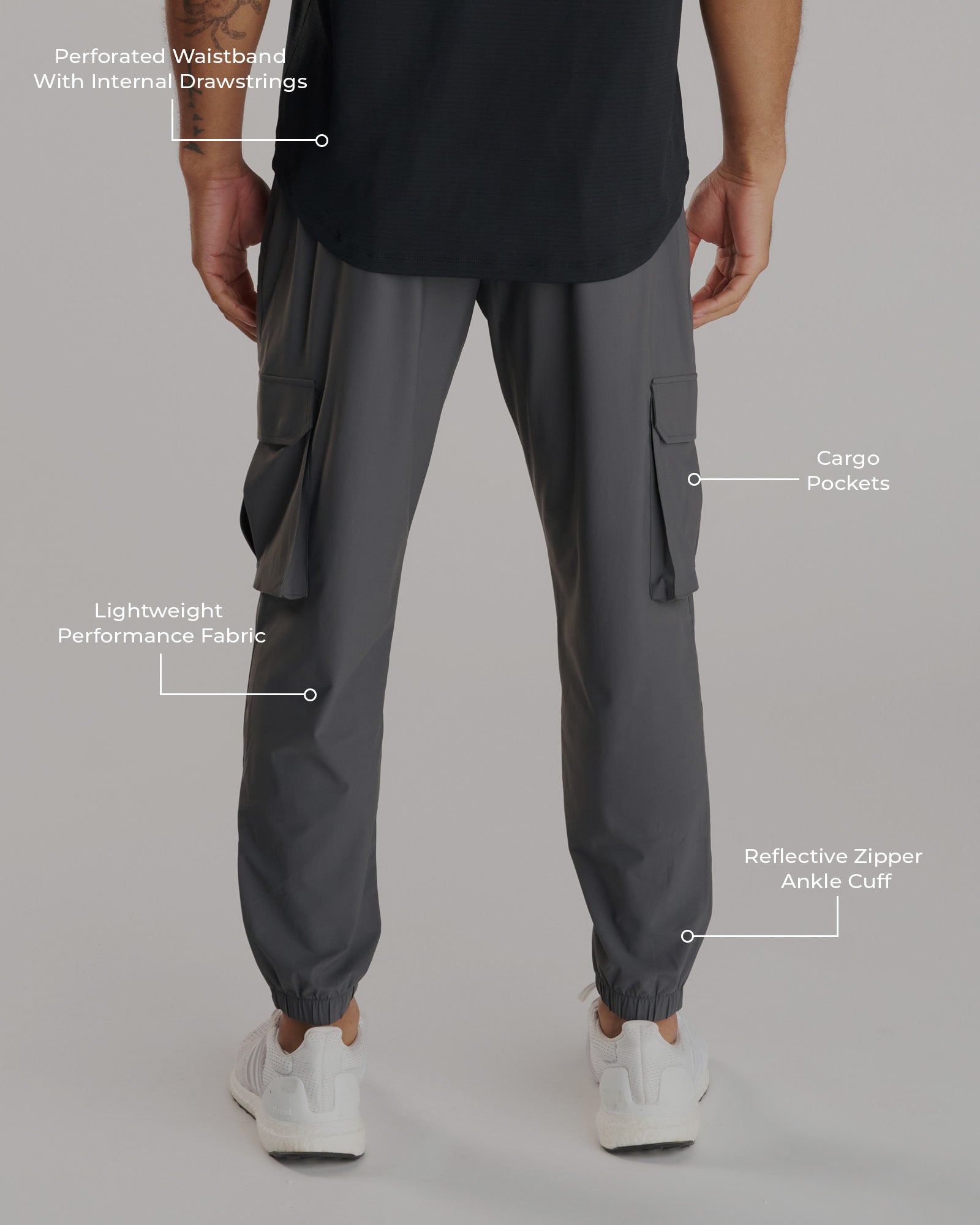 Back view of the Vapor-Lite Cargo Jogger in Space Grey with callouts highlighting waistband, cargo pockets, fabric, and ankle cuff.