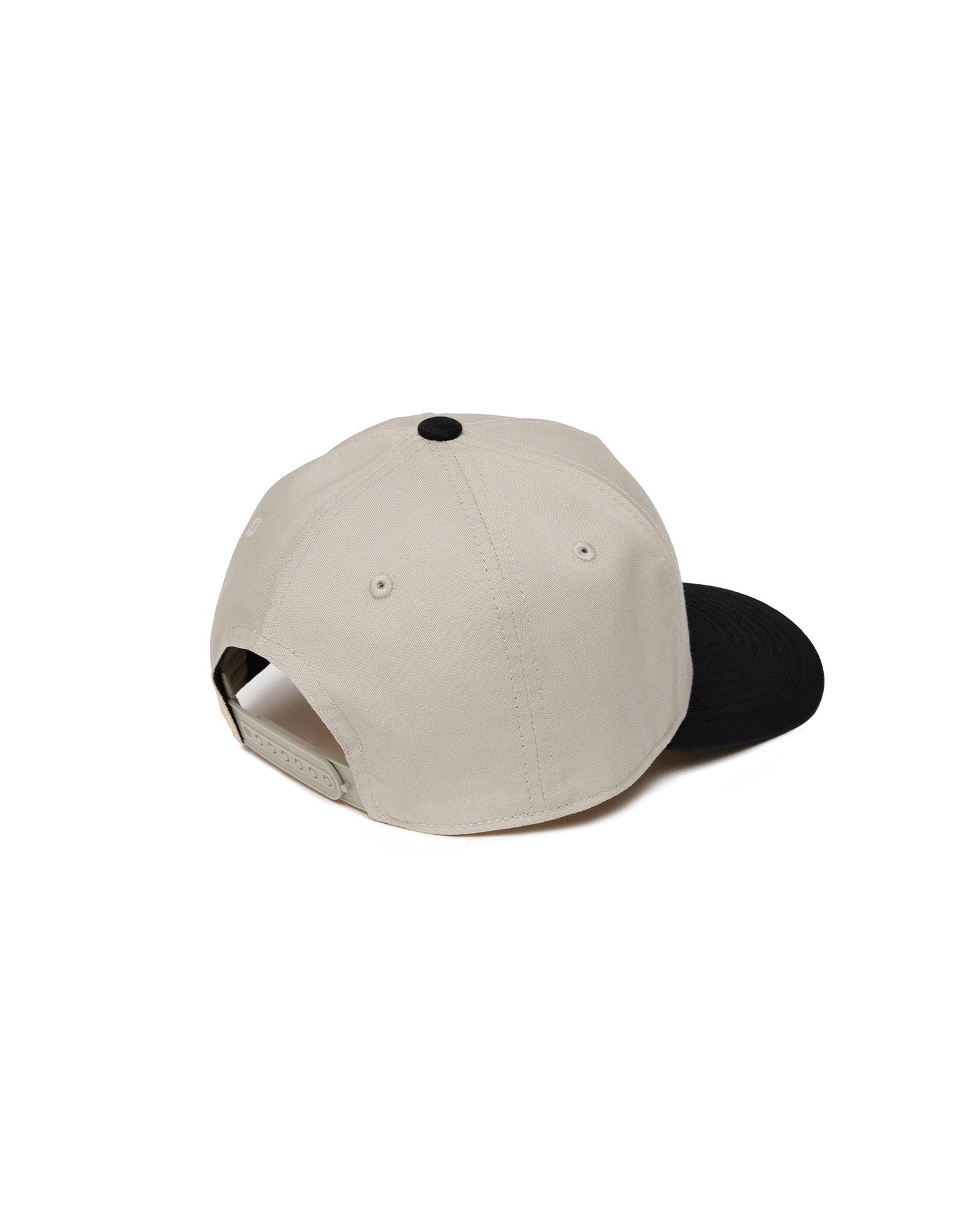 Signature Two-Tone Hat Bundle Pack in cream and black, flatlay showing back angle with snapback closure.