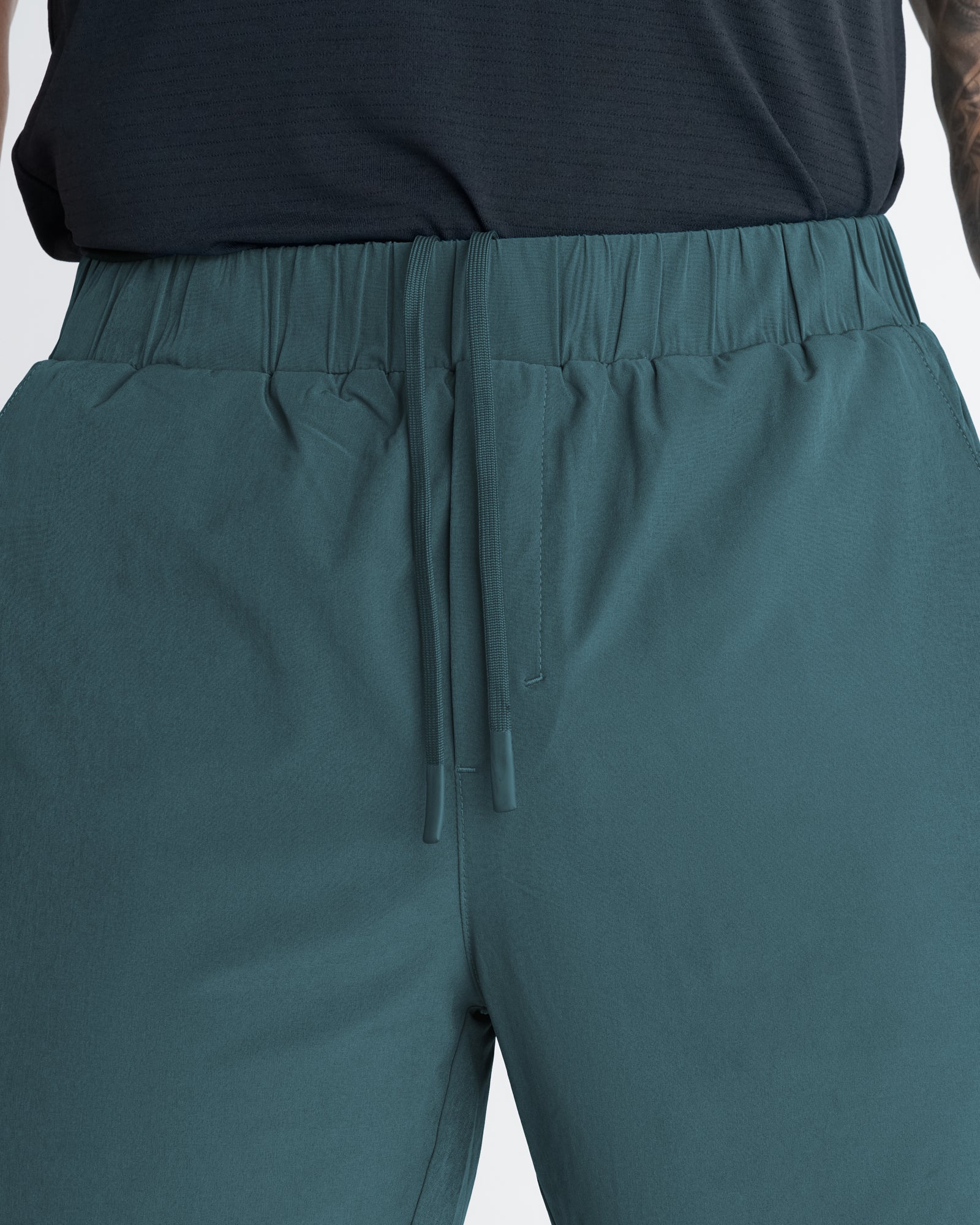 Close-up front view of the Pulse Tech Liner Short in Teal showing elastic waistband and drawstring detail.