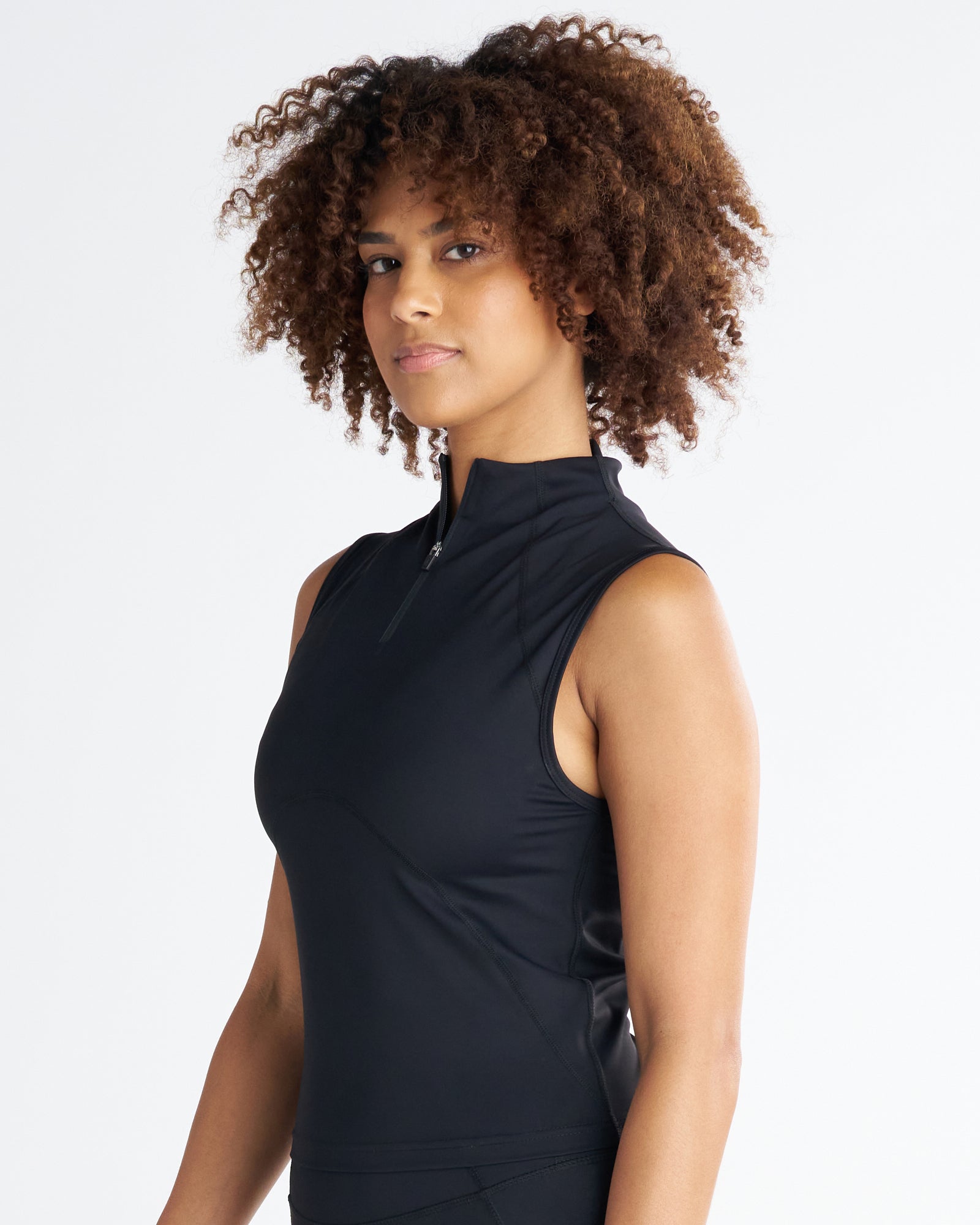 Model wearing the black Endura-Train Quarter Zip Tank at a slight side angle, showcasing the mock neck zip detail.