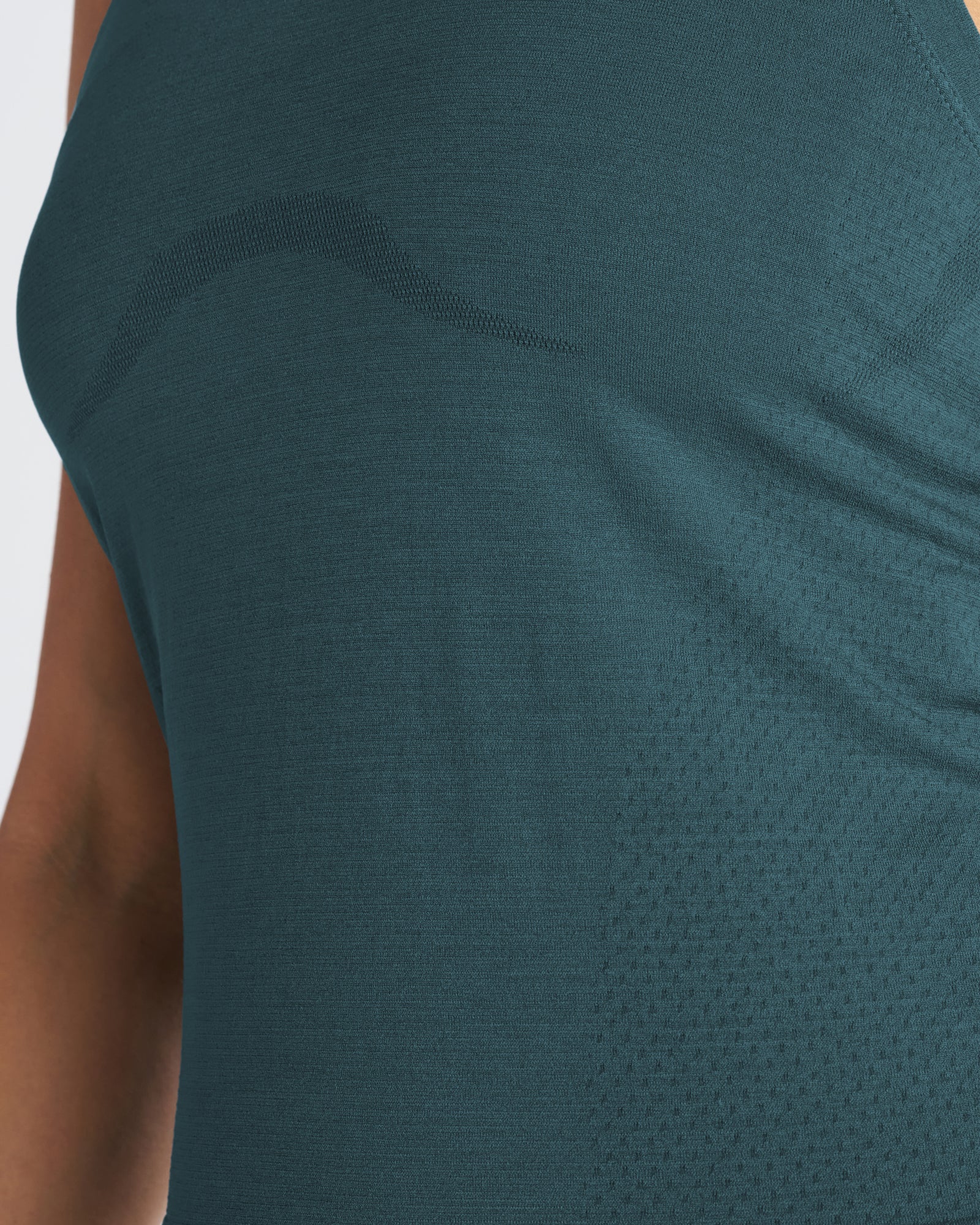 Close-up detail of the Women's Seamless Tank in Teal showing the shoulder seam and subtle texture variation.