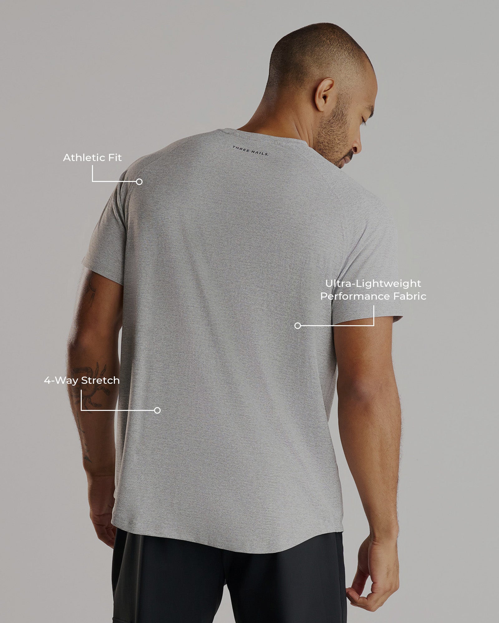 Aion-Lite Tee Cross in Grey Marl, back view on male model with feature callout labels.