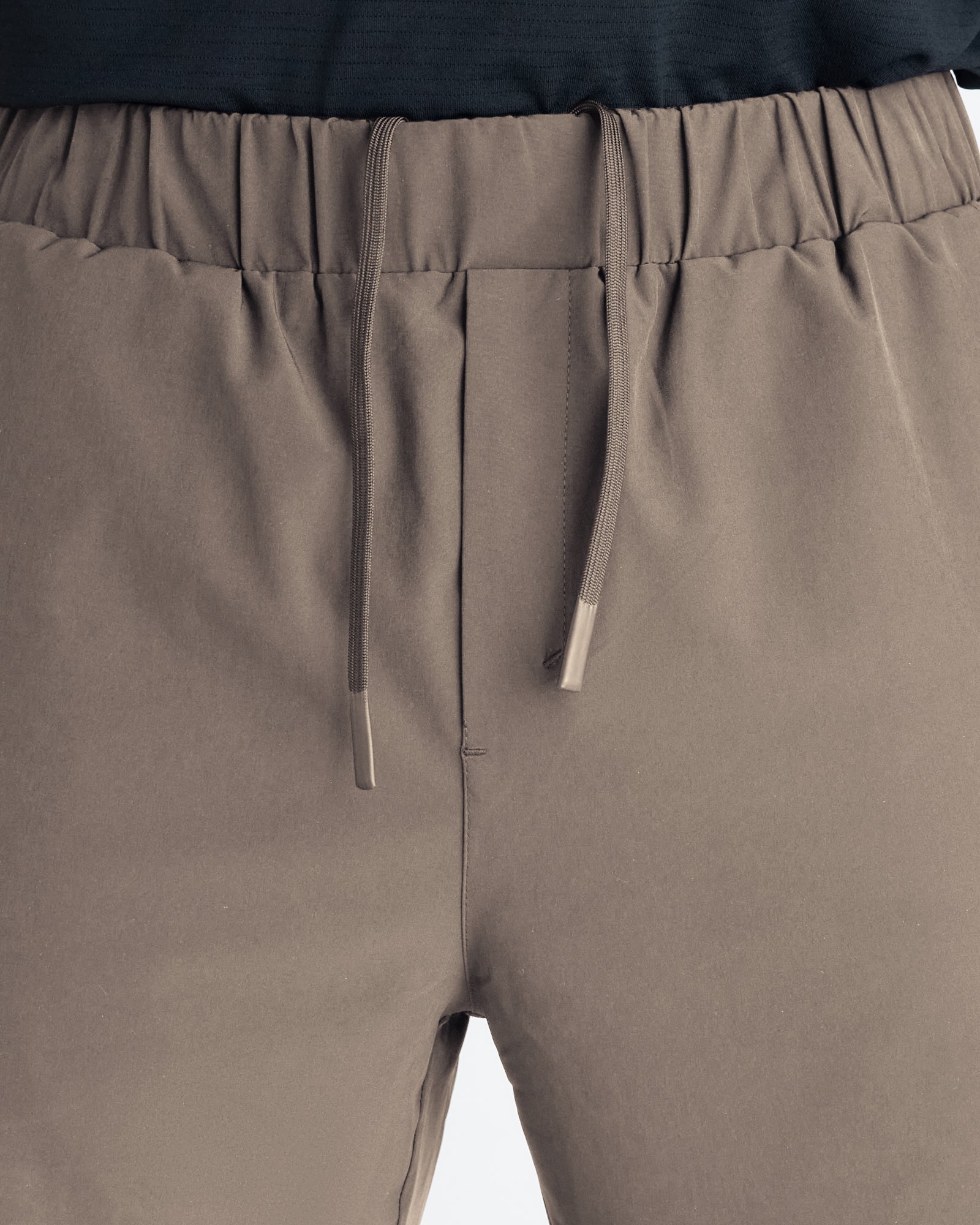 Close-up of the Pulse Tech Liner Short in Sand showing the elastic waistband and drawstring detail.