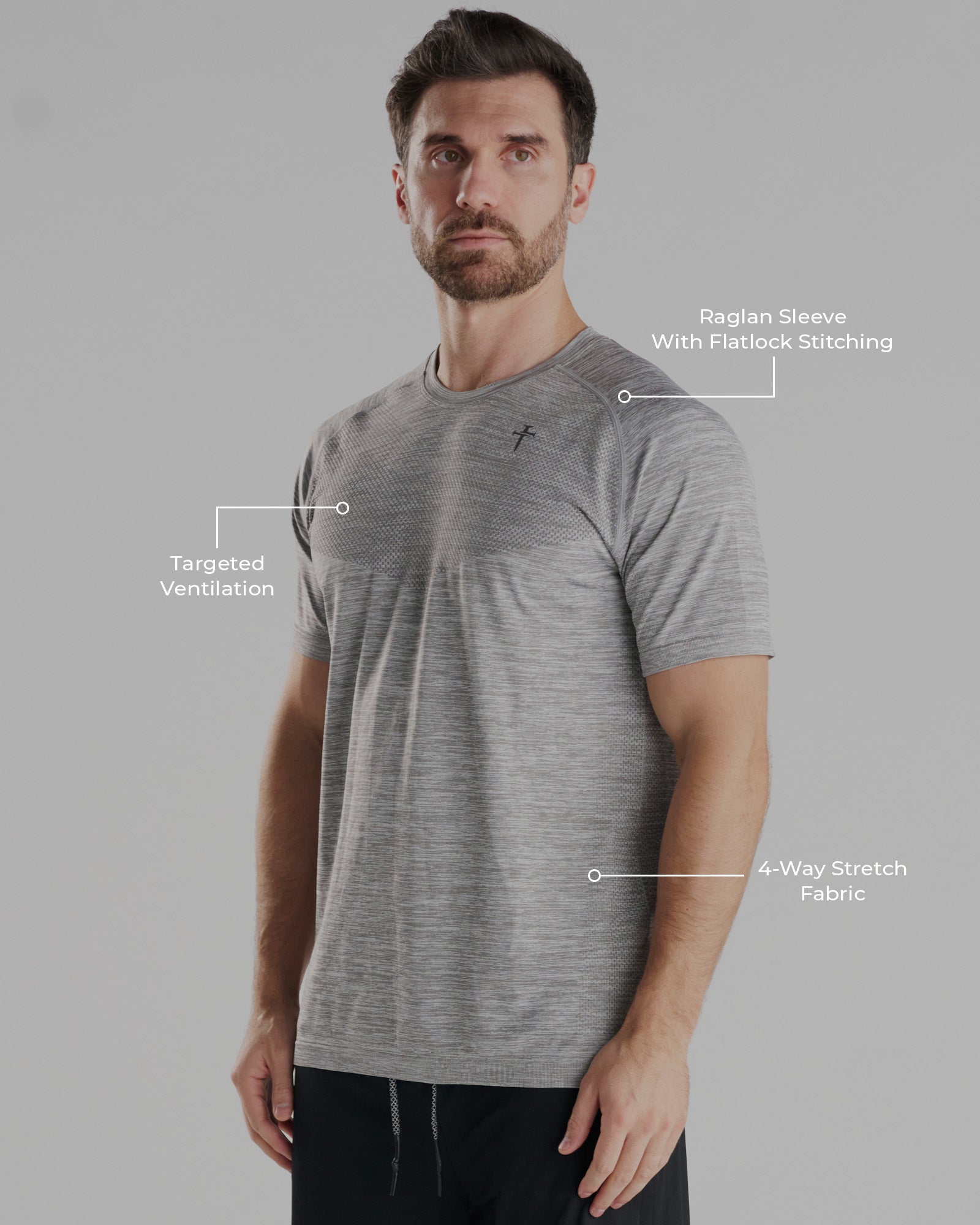 Man wearing Seamless Tee in Grey Marl, slight side angle, with labeled feature callouts visible.