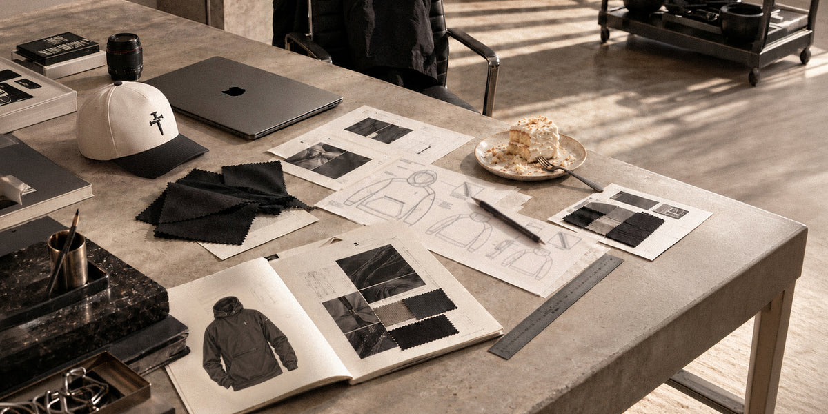 Three Nails design desk with cap, sketches and anniversary cake