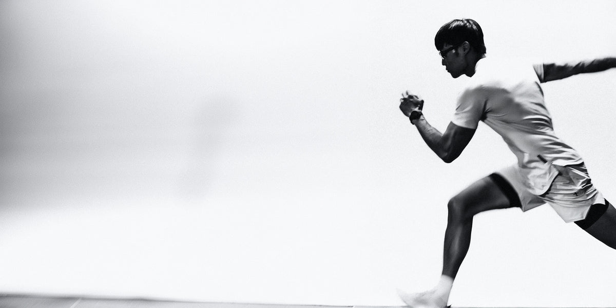 Runner mid-stride in Three Nails training gear, end of season sale